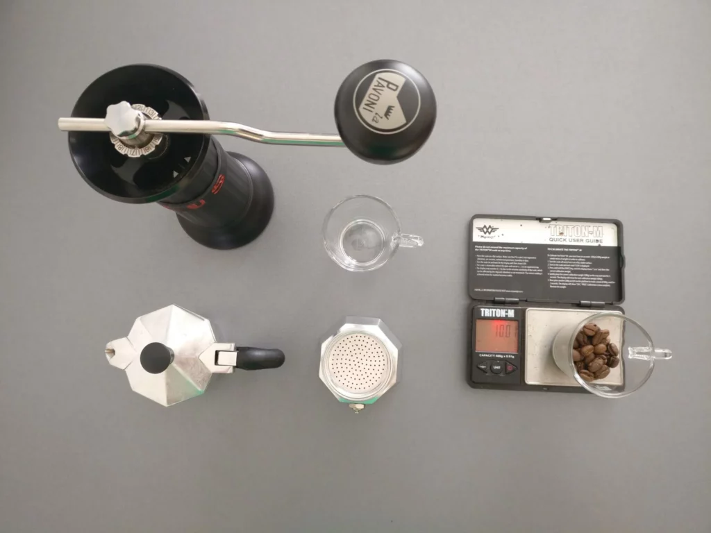 Succeeding in making coffee with a moka pot: the secrets revealed : a coffee grinder, a scall, one cu^and a moka pot
